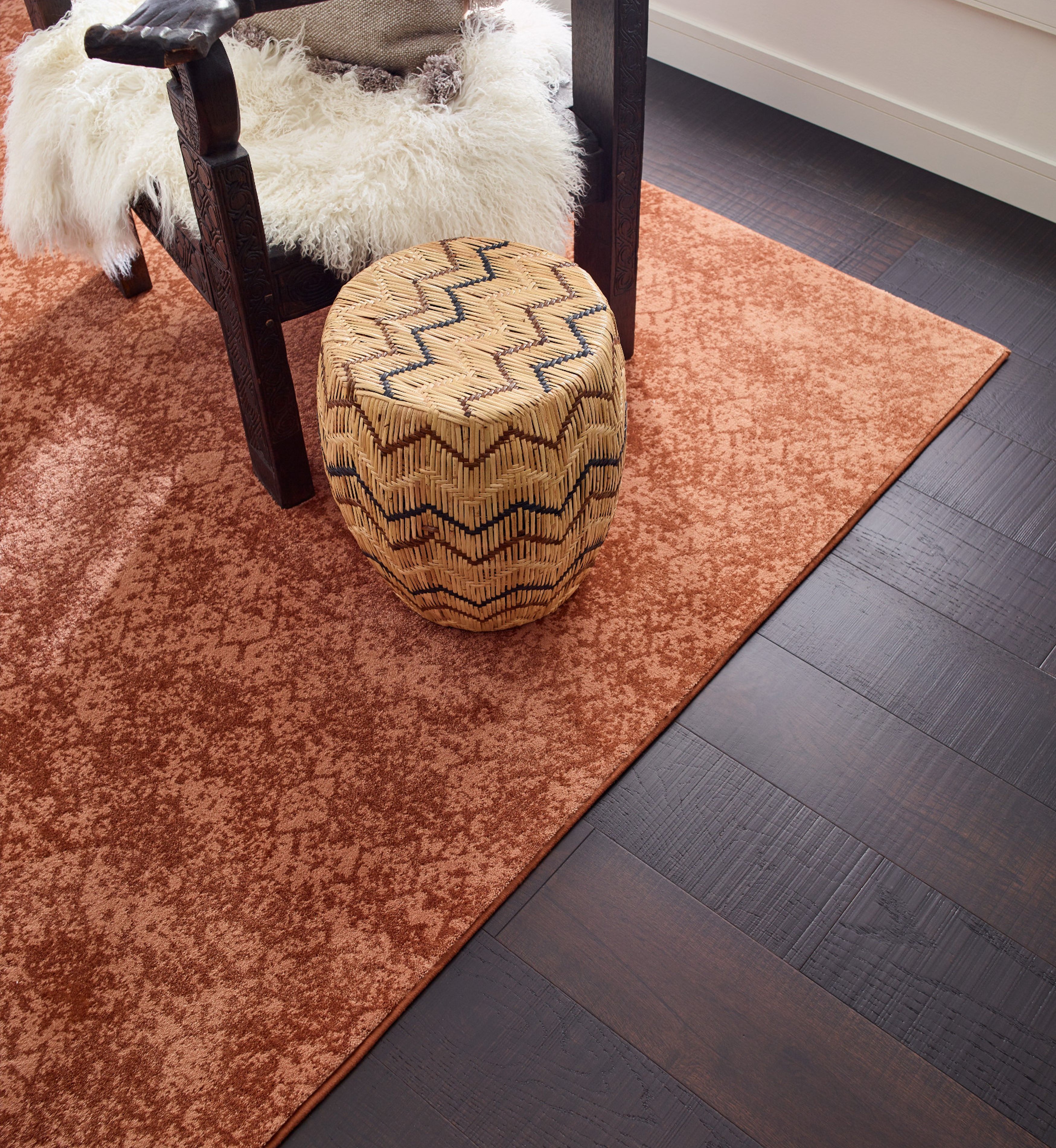 A red rug on the floor by Howard Carpenter Floor Covering in Danville KY