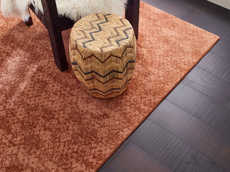 A red rug on the floor by Howard Carpenter Floor Covering in Danville KY