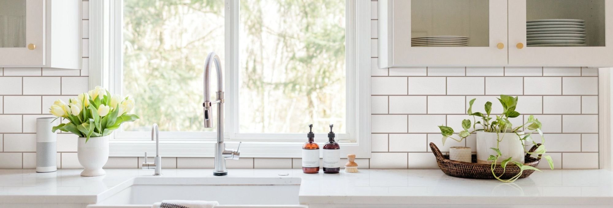 Kitchen with ustensils and white wall tiles from Howard Carpenter Floor Covering in Danville KY