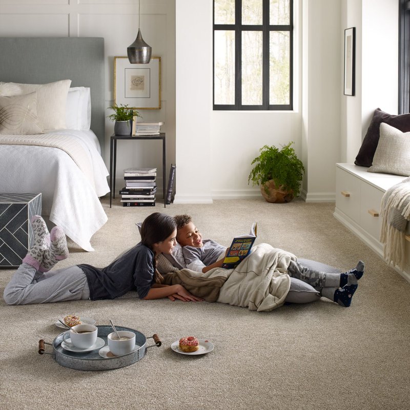 Kids are reading on beige soft carpet from Howard Carpenter Floor Covering in Danville KY