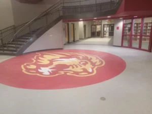 lion logo on floor | Howard-Carpenter Floor Covering